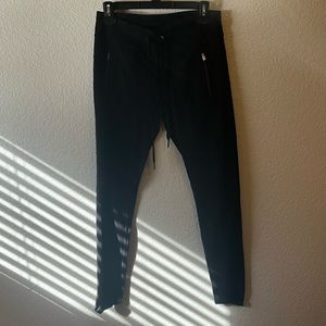 Calvin Klein Performance black leggings with front zippers, size medium.